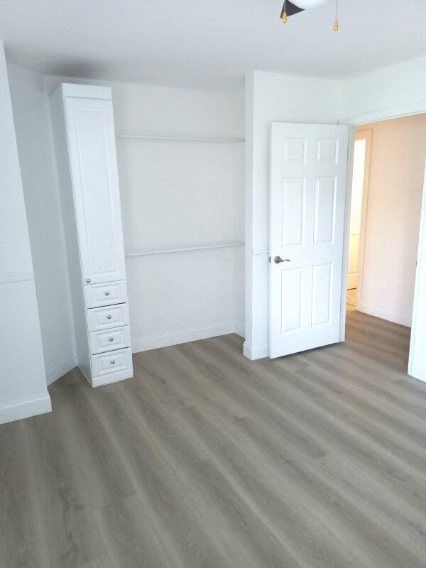 unfurnished bedroom with wood-type flooring