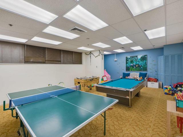 rec room featuring light colored carpet, a drop ceiling, and pool table