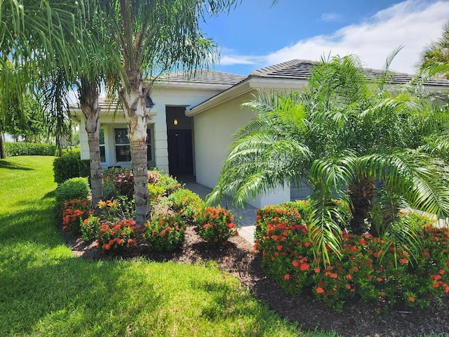 view of home's exterior with a lawn