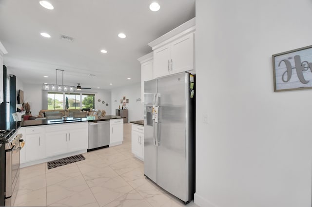 kitchen with white cabinetry, ceiling fan, stainless steel appliances, and sink