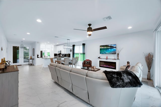 living room with ceiling fan