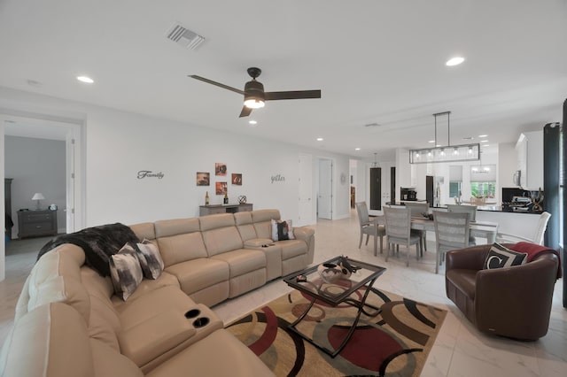 living room with ceiling fan