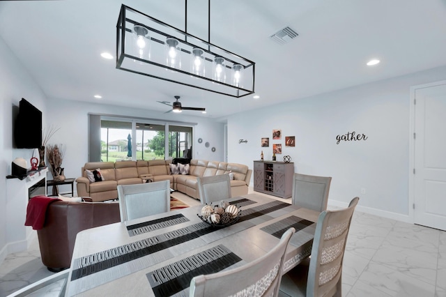 dining space with ceiling fan