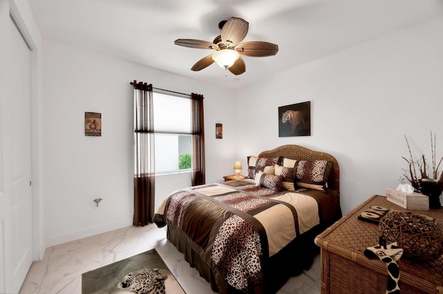 bedroom featuring ceiling fan and a closet