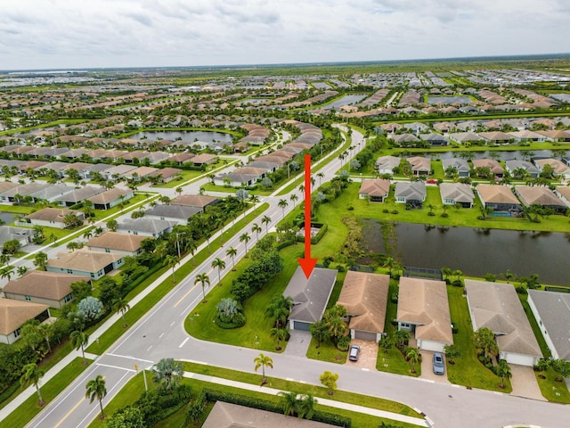 birds eye view of property with a water view