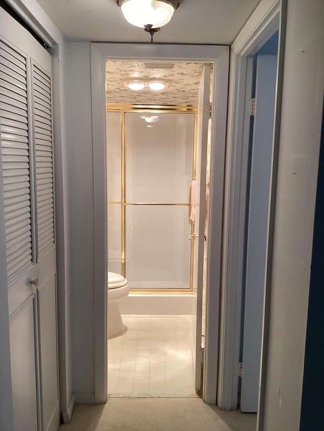 hallway with light tile patterned flooring