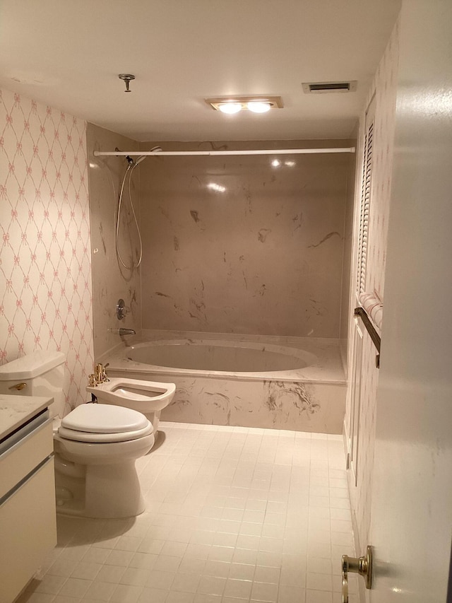 full bathroom featuring toilet, shower / bathing tub combination, vanity, and a bidet