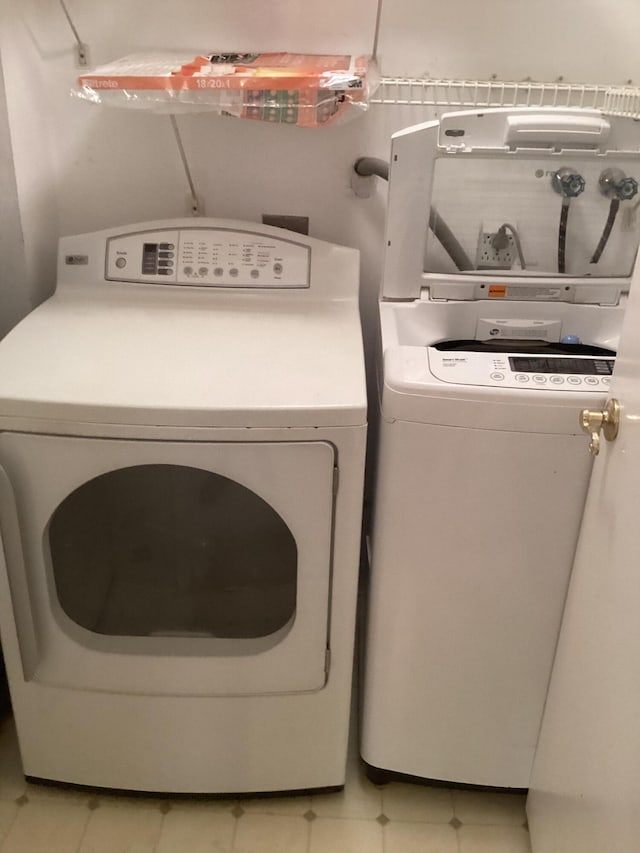 laundry room with washer and dryer