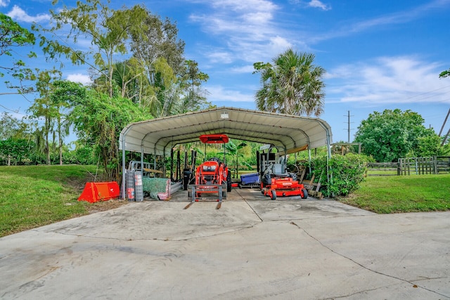 view of parking with a lawn and a carport