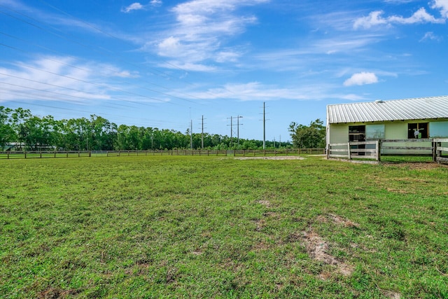 view of yard with a rural view