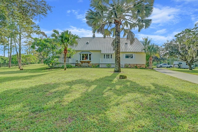 single story home featuring a front yard and covered porch