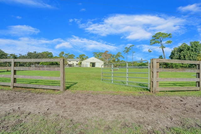 view of yard with a rural view