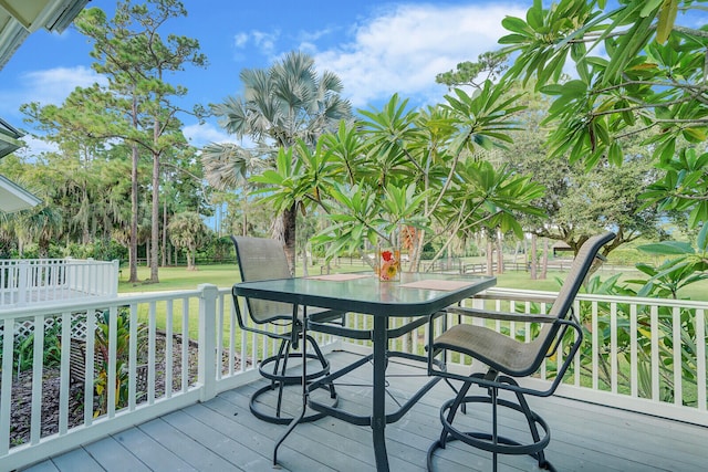 wooden deck with a yard