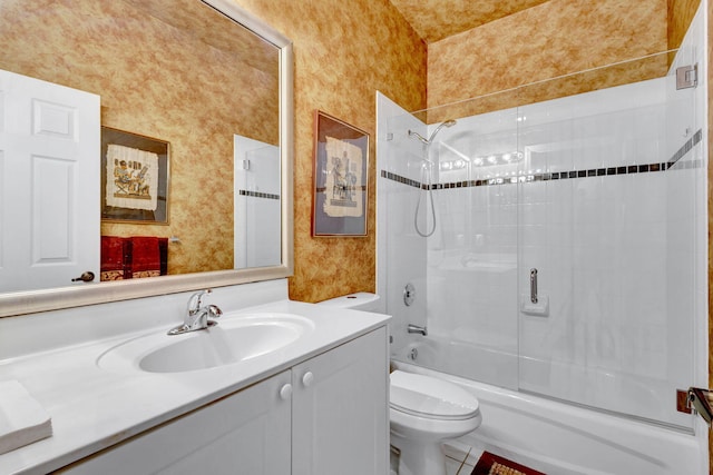 full bathroom with vanity, combined bath / shower with glass door, toilet, and tile patterned floors