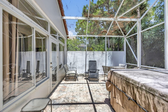 view of patio with glass enclosure