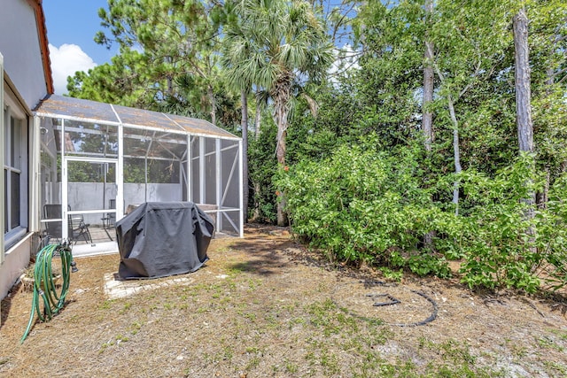 view of yard featuring a lanai