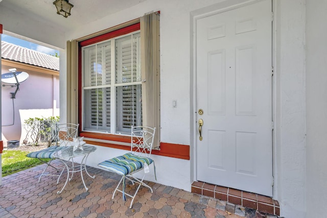 doorway to property featuring covered porch