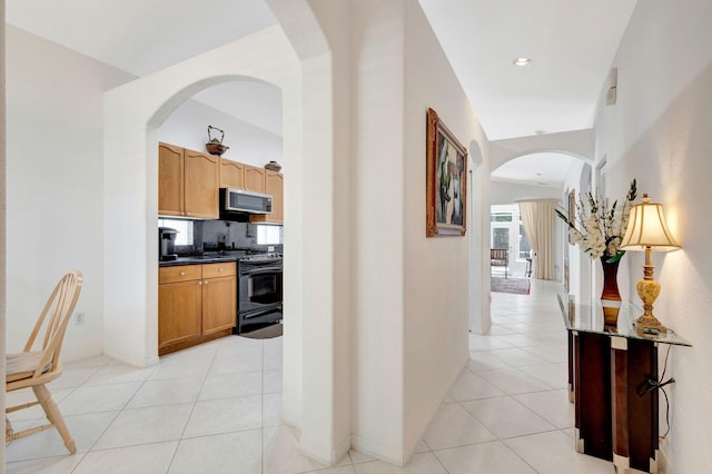 corridor featuring light tile patterned flooring