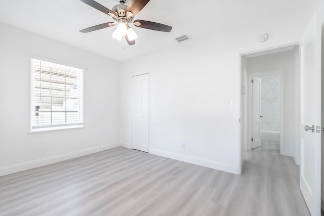 unfurnished room with ceiling fan and light hardwood / wood-style floors