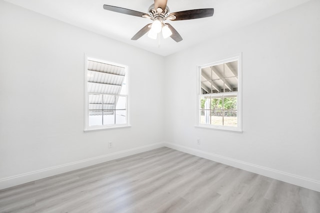 empty room featuring wood-type flooring and ceiling fan