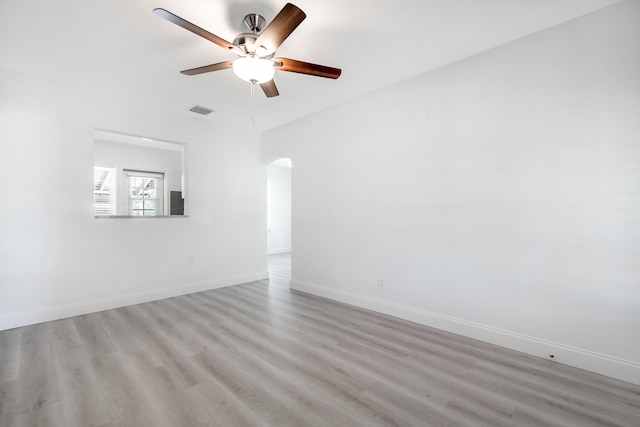 spare room featuring ceiling fan and light hardwood / wood-style floors