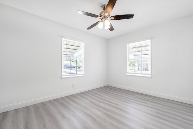 unfurnished room featuring ceiling fan and light hardwood / wood-style flooring