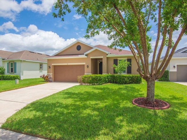 ranch-style home featuring a front lawn and a garage