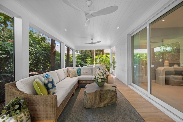 sunroom / solarium featuring ceiling fan and plenty of natural light