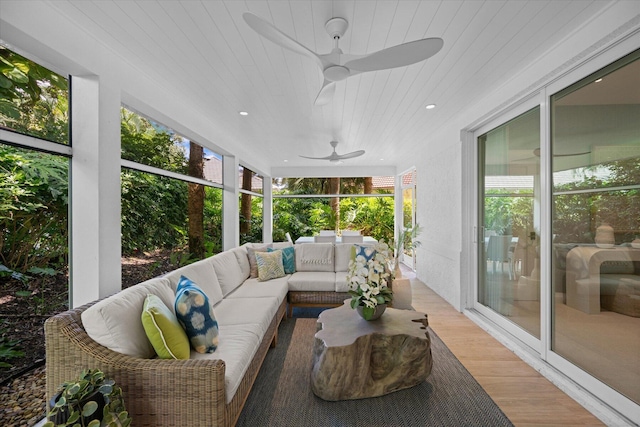 sunroom / solarium featuring wood ceiling and ceiling fan