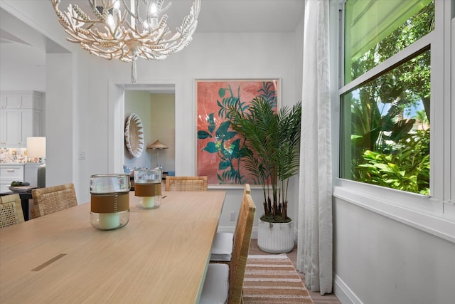 dining space with a notable chandelier