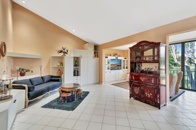 tiled living room with high vaulted ceiling