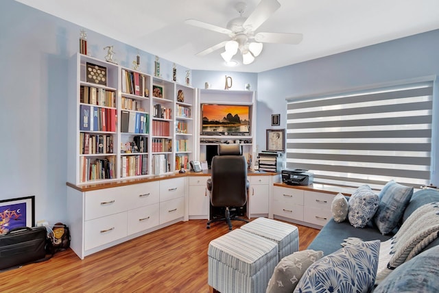 home office featuring ceiling fan and light hardwood / wood-style floors