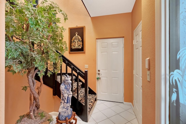 foyer featuring light tile patterned flooring