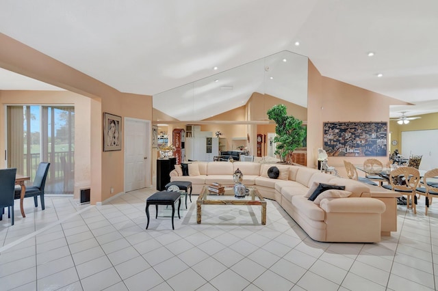 living room with high vaulted ceiling, ceiling fan, and light tile patterned flooring