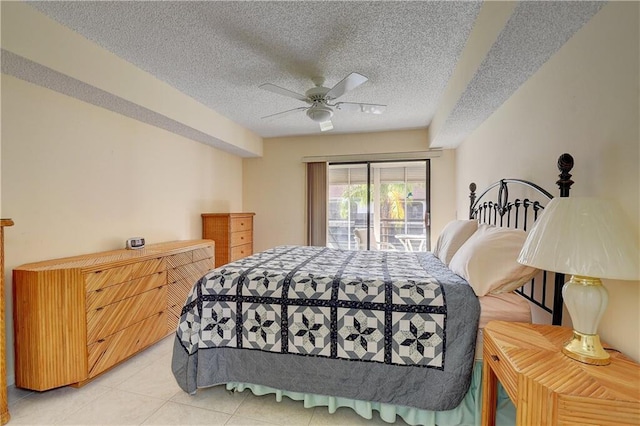 bedroom featuring access to exterior, light tile patterned floors, a textured ceiling, and a ceiling fan