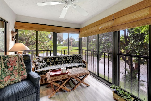 sunroom / solarium with a wealth of natural light and ceiling fan