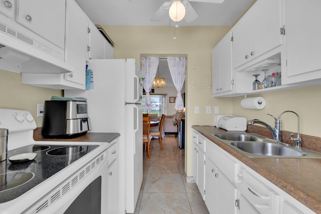 kitchen with light tile patterned flooring, white cabinetry, ceiling fan, sink, and stove