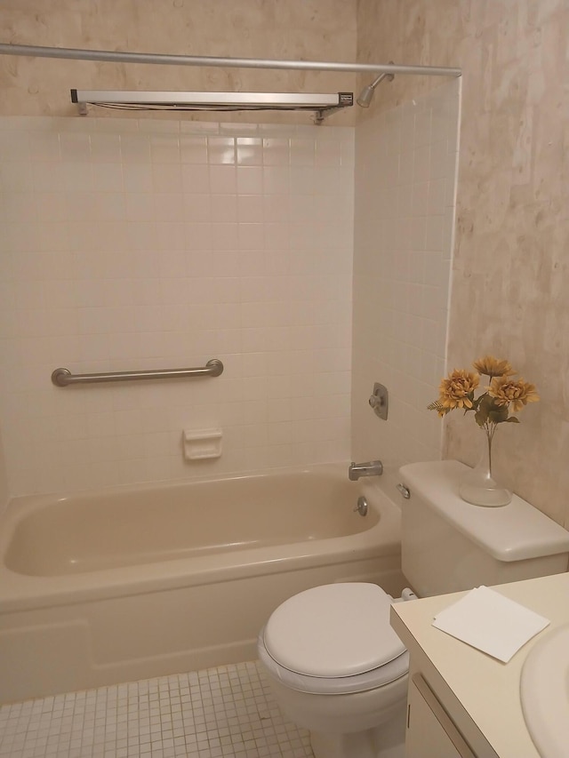 full bathroom with tile patterned flooring, vanity, toilet, and tiled shower / bath