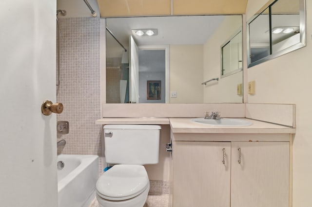 full bathroom featuring vanity, toilet, tile patterned floors, and tiled shower / bath