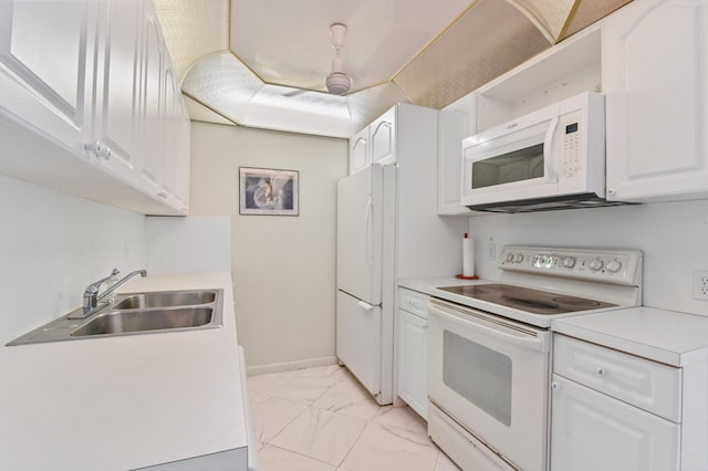 kitchen with white cabinetry, sink, and white appliances