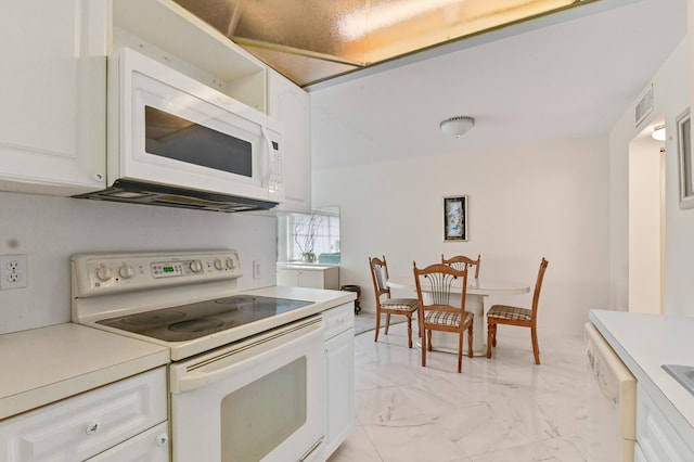 kitchen with white cabinets and white appliances