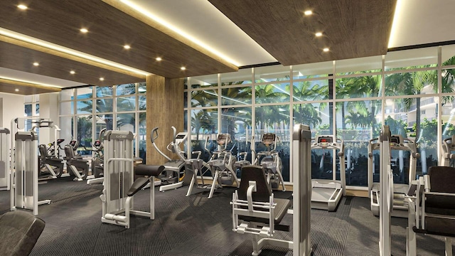 gym featuring a wall of windows, wood ceiling, and recessed lighting