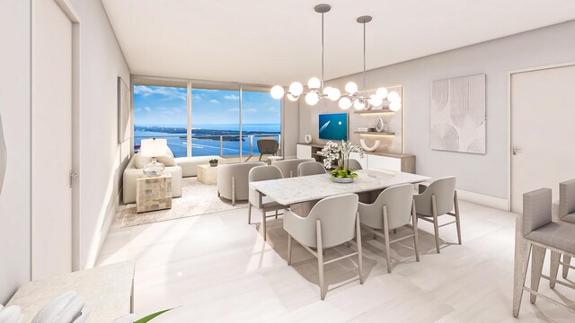 dining area with a chandelier and baseboards