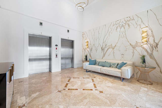 tiled living room featuring elevator and a high ceiling