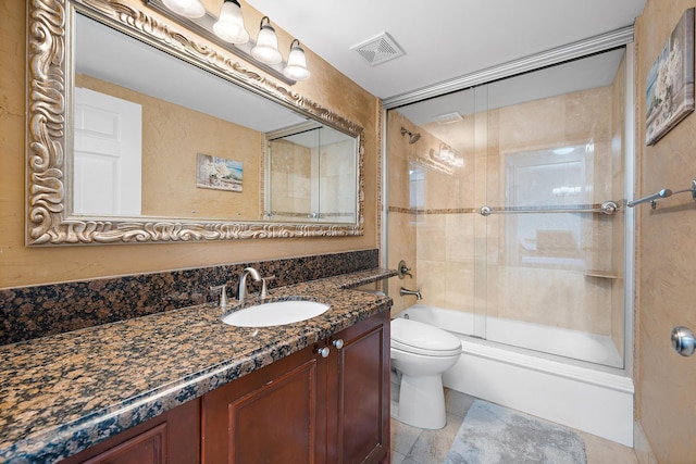 full bath with visible vents, toilet, enclosed tub / shower combo, vanity, and tile patterned floors