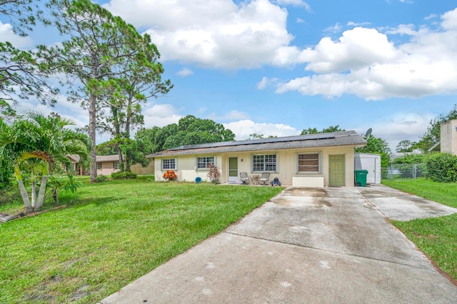 ranch-style home with a front yard