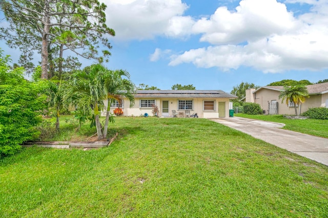 ranch-style house with a front yard