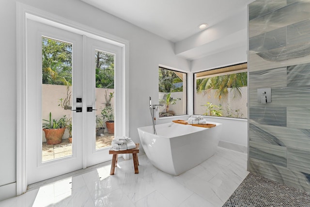 interior space featuring marble finish floor, french doors, and recessed lighting