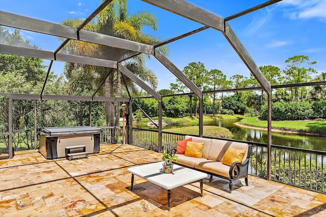 unfurnished sunroom featuring a water view