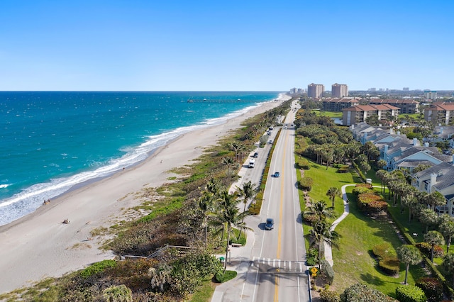 bird's eye view featuring a beach view and a water view